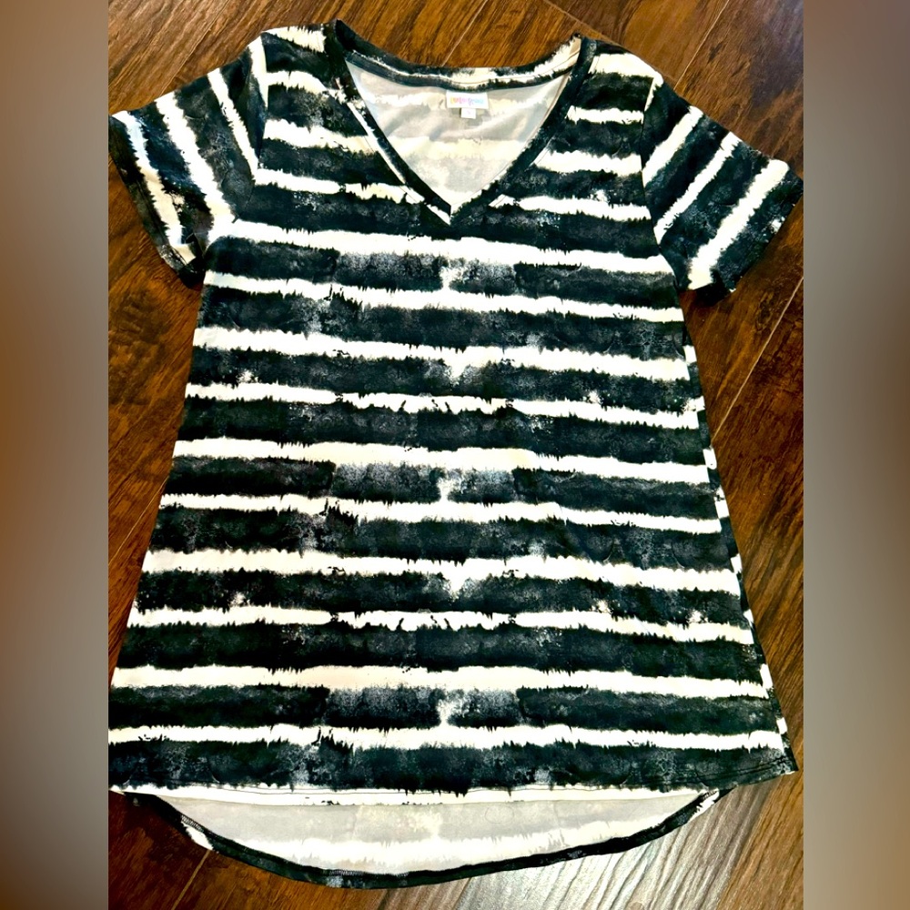 Very soft V neck tee. Only worn once. Like brand new. White , black & dark blue.
